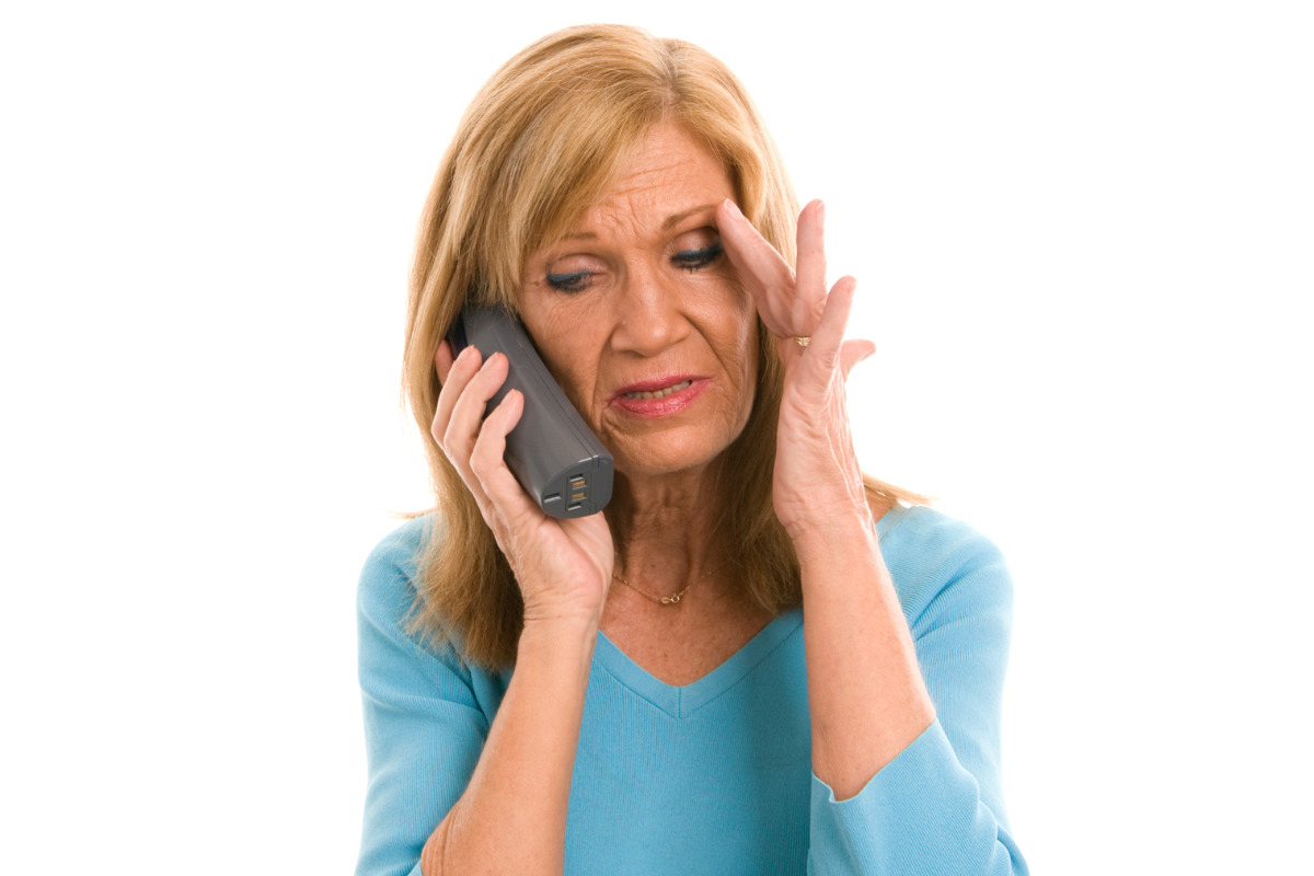 worried woman on the phone